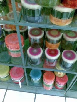 scented candles - scented candles of different scents and colors being displayed in a department store