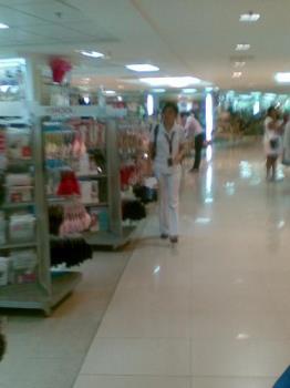 school uniform - a college student of a medical school seen in uniform in a mall