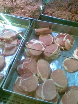 meat - ground pork and pork chop on display in a supermarket