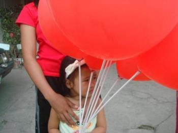 balloons - big balloons held by a child