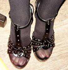 Pretty sandals - stocking feet in a pretty black sandals