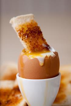 Boiled Egg and soldiers - This is just a boiled egg with slices of buttered toast to dip in it!!
