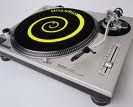 Turntables - Turntables for playing vinyl music records. Plays at varies speeds ususally 45rpm or 33.3rpm. The stylus on the arm reads the grooves on the record , so producing the sound.