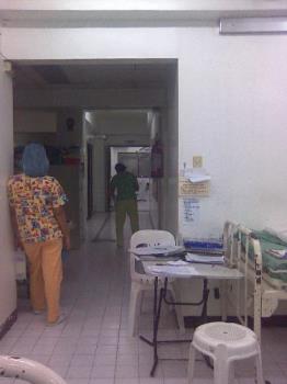 Madam Flor was mopping the floor.  - Look at our labor room/delivery room complex.