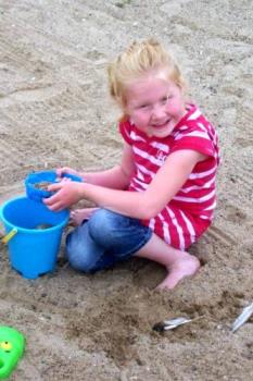 Alice at the beach - This is a picture of my young granddaughter, Alice, enjoying a day on the beach.