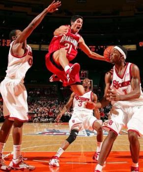 An NBA game in Progress - This photo depicts the heat, the involvement, in Basketball, which is a major sporting industry today. An NBA game in Progress - This photo depicts the heat, the involvement, in Basketball, which is a major sporting industry today.