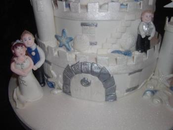 Models on cake - Bride and Groom and pageboy added to cake Models on cake - Bride and Groom and pageboy added to cake
