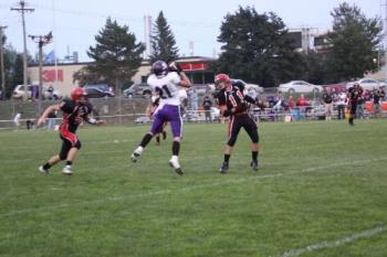 Receiver making a catch - This was taken with a Canon 50 D using a sigma 28-300 zoom lense. The zoom was about 200 mm and I was shooting at a speed of 3200 ISO. I use a mono pod to help steady the camera and allow me to use both hands on the camera.