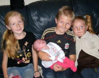 Four of my grandchildren - Harry, Alice and Amy meet their new cousin Olivia for the first time