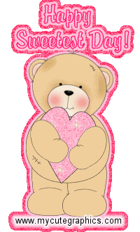 Happy Sweetest Day - A brown cartoon bear holding a pink heart with a caption, "Happy Sweetest Day". 