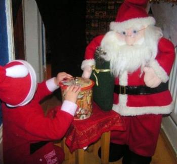 Santa and Harry - My old Santa with his tub of biscuits
