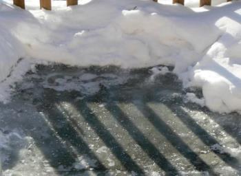 my sidewalk - This is my sidewalk that had ice on it that was so frozen that I threw rock salt on it and it still didnt get rid of the ice it was so thick.