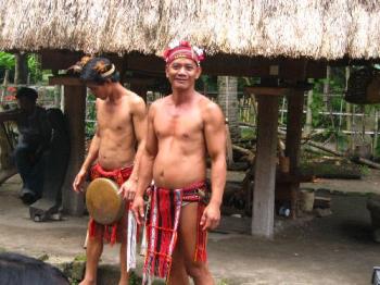 Tribal warriors -  Northern Philippines tribal warriors in authentic costumes. antique gong and dagger