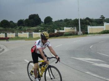 Biking down the road - Biking is his passion Biking down the road - Biking is his passion