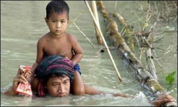 flood in my land - The dad is rescuing his son from flood flood in my land - The dad is rescuing his son from flood