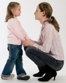 Child and mother - Mother is listening what is saying her daughter