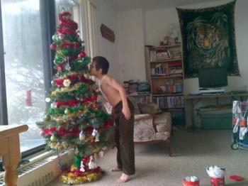 My son with our Christmas Tree 2011 - My son mainly did the decorating, I only helped a bit.