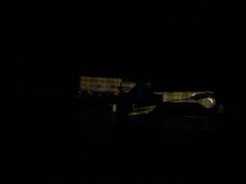 flipped plane - It's dark,with a phone camera,through a chain link fence! but You can make out the wing being on the ground,and a Tanker truck (the right way up!) in the background... 