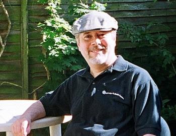 Will he sneeze? - This guy (me a few years ago) is (or rather was) sitting outside in the garden in what I think is (was) summer and the sun, or plants, can cause a person to sneeze in the summer.