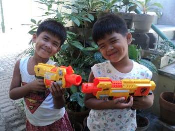 Happy Children - Happy over their new toy guns