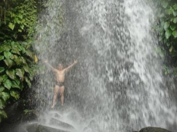 Showering under the waterfalls - Cool and refreshing bath