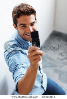A man taking a picture from mobile - A man capturing the picture of a girl 