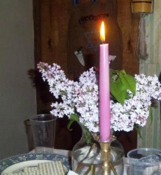 candle and lilacs - This is what my Seder table had as a centerpiece. candle and lilacs - This is what my Seder table had as a centerpiece.