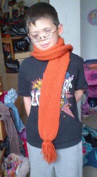 My son with a loom-knitted tube scarf - Loom-knitted tube scarf it doubles over automatically and provides extra warmth, fun scarf for kids.