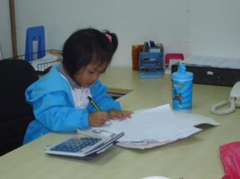 Smart kid - Looks like a little Accountant