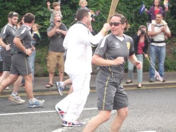 Olympic Torch - The Torch being run.