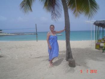 Palm trees swaying - My friend took a picture of me with the sea, the light of the sun at the beach and a palm tree.