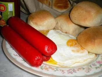 Favorite breakfast plate - Hotdog with egg and pandesal is a comman breakfast favorite of many people. Take out the hotdogs please because this is simply cancerous. 