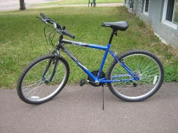 My new ride. - This is the new bike my dad got me recently, it serves me well and I am please with it. It is a cheap Canadian tire bike but, it does its job.