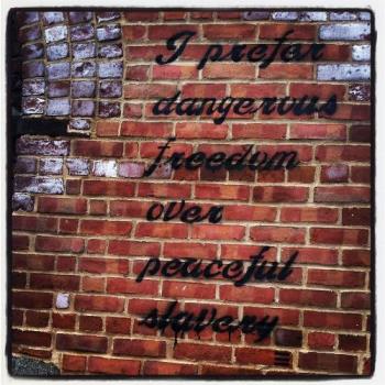 Art? Is it when it is just scribbles? Graffitti? - It is statement. Is it a quote. I really want to know what it means but it really is nice coloring with the brick. I love brick photography. 