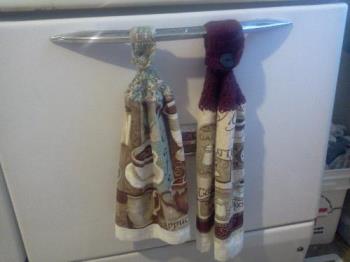 dish towels on my oven door - These are the things my aunt makes and gives out at Christmas.