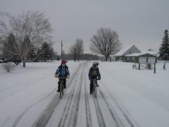 Cycling in the snow with two of my boys. - Picture of winter cycling quite a number of years ago. The snow on this run wasn't too thick. Cycling in the snow with two of my boys. - Picture of winter cycling quite a number of years ago. The snow on this run wasn't too thick.