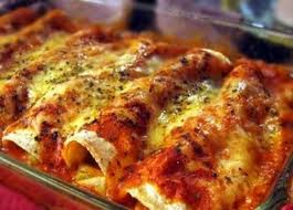 Enchiladas - Enchiladas is a mexican recipe made with corn tortillas, chicken, tomatos, cheese and cream.