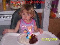 My niece, cole, eating her 2nd birthday cake. By the time she was done, what a mess!