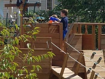 Grandsons playing on pirate ship