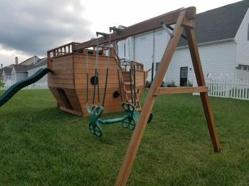 Swing set attached to pirate ship