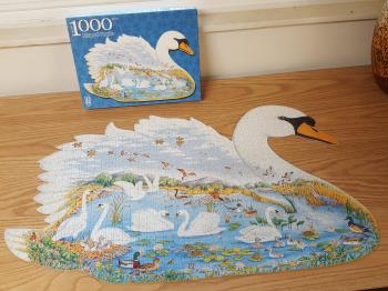 Swan-shaped puzzle with lots of water animals within.