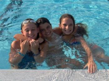 My daughter and friends at a swim meet. - I was so proud of her.