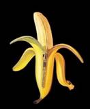 Bananas - A banana half peeled