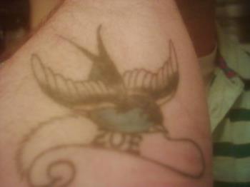 One of 7 - Thiss tattoo is with my daughters name.  The sparrow represents coming home, for they always find their way back home.  So my daughter will always find her way back to me
