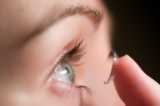 putting in contact lens - Putting in the contact lens.