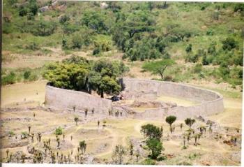 Great Zimbabwe - GREAT ZIMBABWE The ruined city of Great Zimbabwe, near Masvingo, is the largest and most significant ancient monument south of the Sahara. The towering "stone houses" (dzimba dzembabwe) are the remains of a city of 20 000 shona- speaking people which prospered between the 12th and 15th centuries. The grand concept is an eloquent testament to the advanced culture of its African builders. A beautiful stylised soapstone fish eagle now the national emblem, was found in the ruins. The sculpture has pride of place in the site museum. The whole complex extends across 270 hectares and a whole day visit is strongly recommended. Great Zimbabwe On top of the hill, a dry stone citadel set among giant boulders overlooks the valley. It is a breathtaking view. Down below is an enclosure 250m in diameter with double walls up to 100m high, a great conical tower, smaller towers and many lesser enclosures linked to sunken passageways and walls. Everything has been constructed entirely without mortar – a million stones, each one balancing on each other. Nearby Lake Mutirikwi is a popular water sports resort, with excursions to bird Rich Island and pony trekking in the game reserve on the north shore. Visit nearby traditional villages where the true Zimbabwean hospitality awaits you. This is an experience you should never miss.