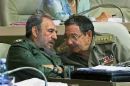 Fidel and Raul Castro - picture of Fidel Castro and his brother Raul in conversation.