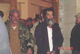 Saddam - This is a photo of Saddam Hussein in custody.