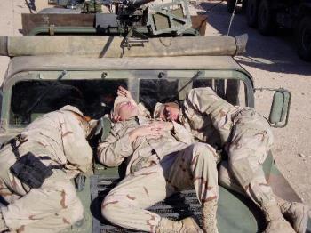 Troops catching sleep while they can. - These soldiers are getting sleep when they can and will soon be going on pratol in Iraq.  They are all volunteer members of the Army.