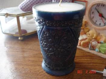kEEPSAKE CANDLE - Here is a candle made from an crystal family heriloom votive. It it molded blue with gold accent paint and the out shell it glazed so it doesn't melt. You can take them back to have refilled with your favorite candle scent